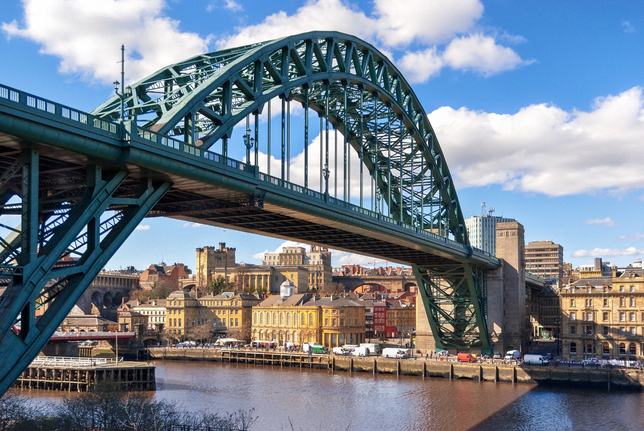 The green Tyne Bridge over the River Tyne in Newcastle, with the Quayside behind